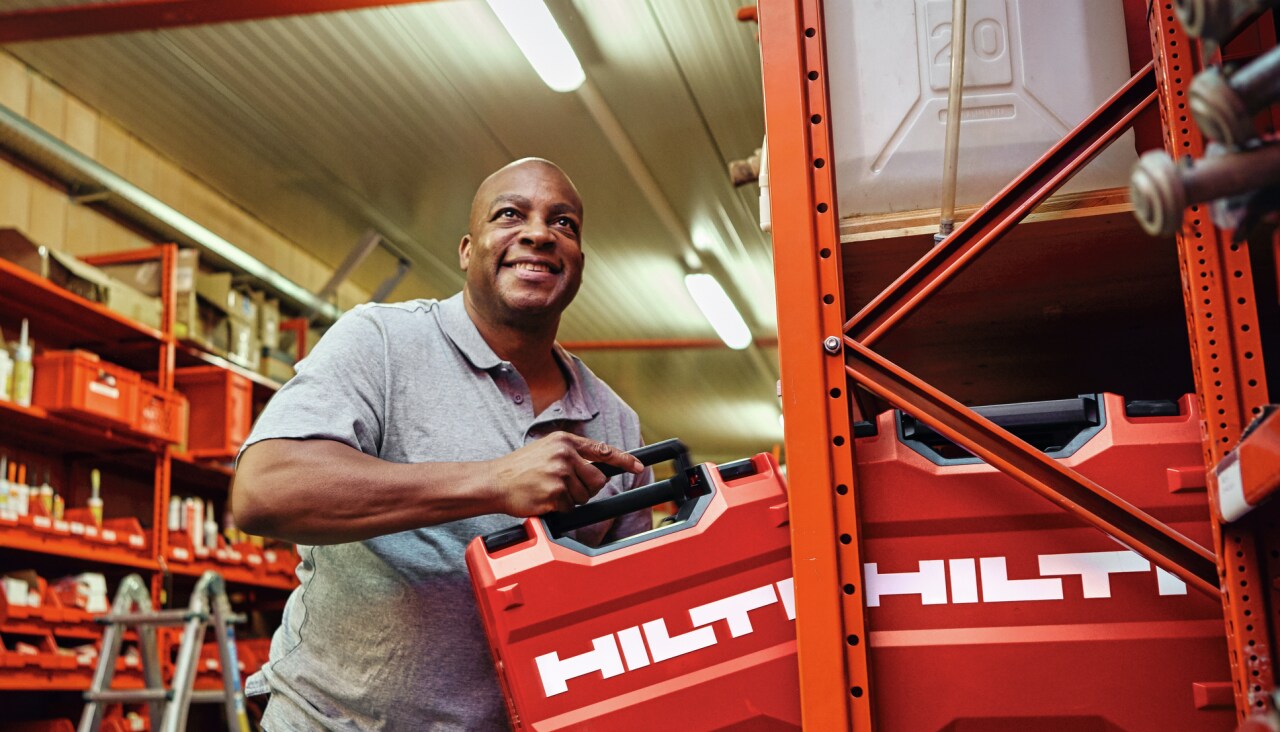 Tool Crib Manager putting away a Hilti Tool Box on a shelf in the warehouse